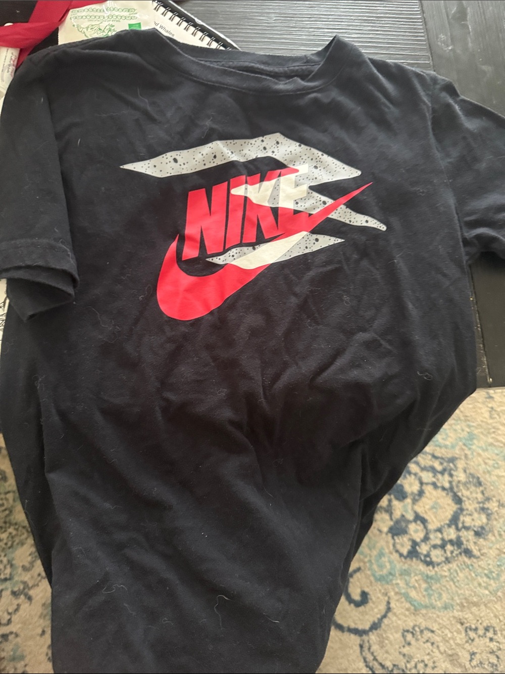 Nike Black Tee with Red Swoosh and White Speckle Graphic